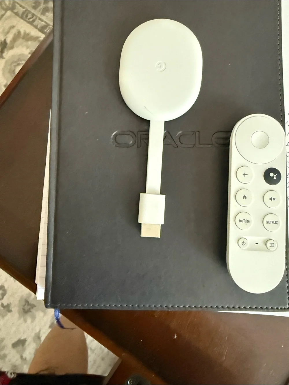 google streaming puck and voice remote in white
